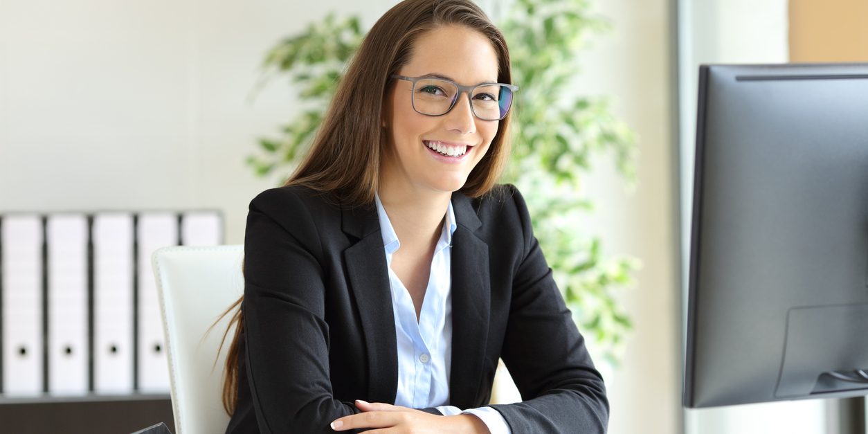 Businesswoman with glasses posing at office Businesswoman with glasses posing at office