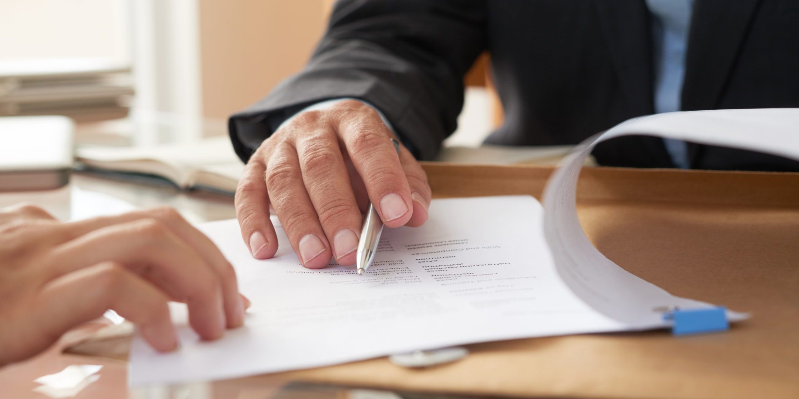 Business people signing a contract Business people signing a contract